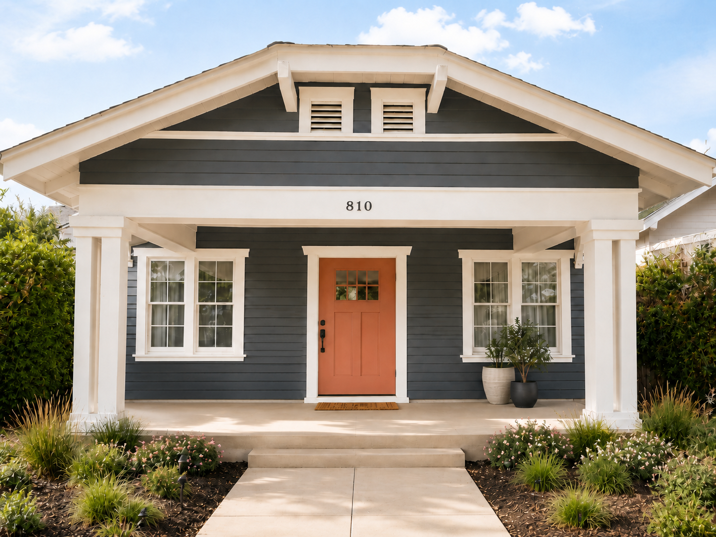 The front entrance of Hangar One, the Ross Home at The Runway Recovery, with a bright red door